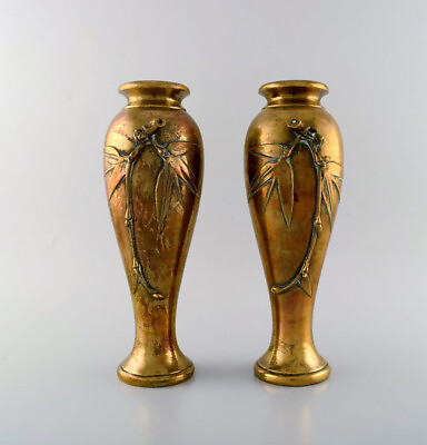 A pair of French art nouveau bronze vases with flowers in relief. Ca. 1890 $840.00